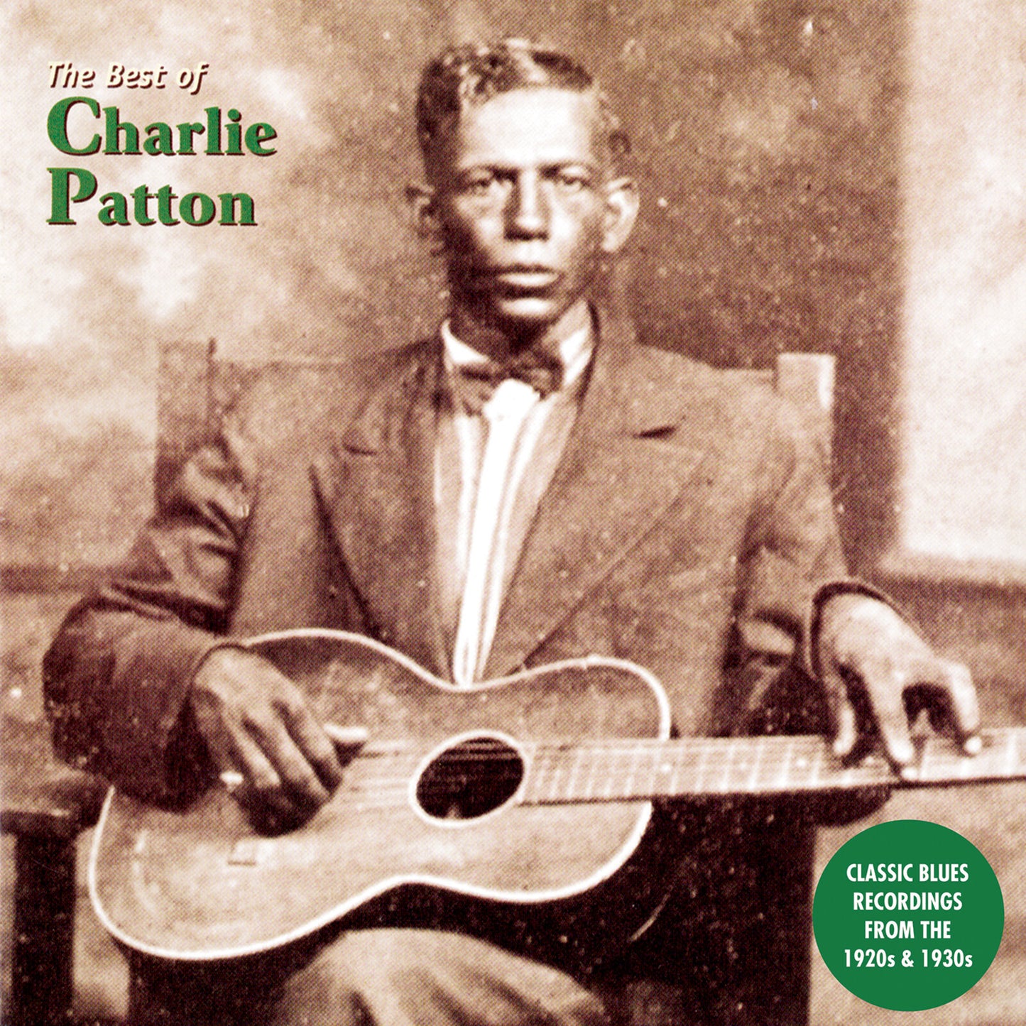Charlie Patton seated, playing a guitar, vintage album cover in sepia tone.