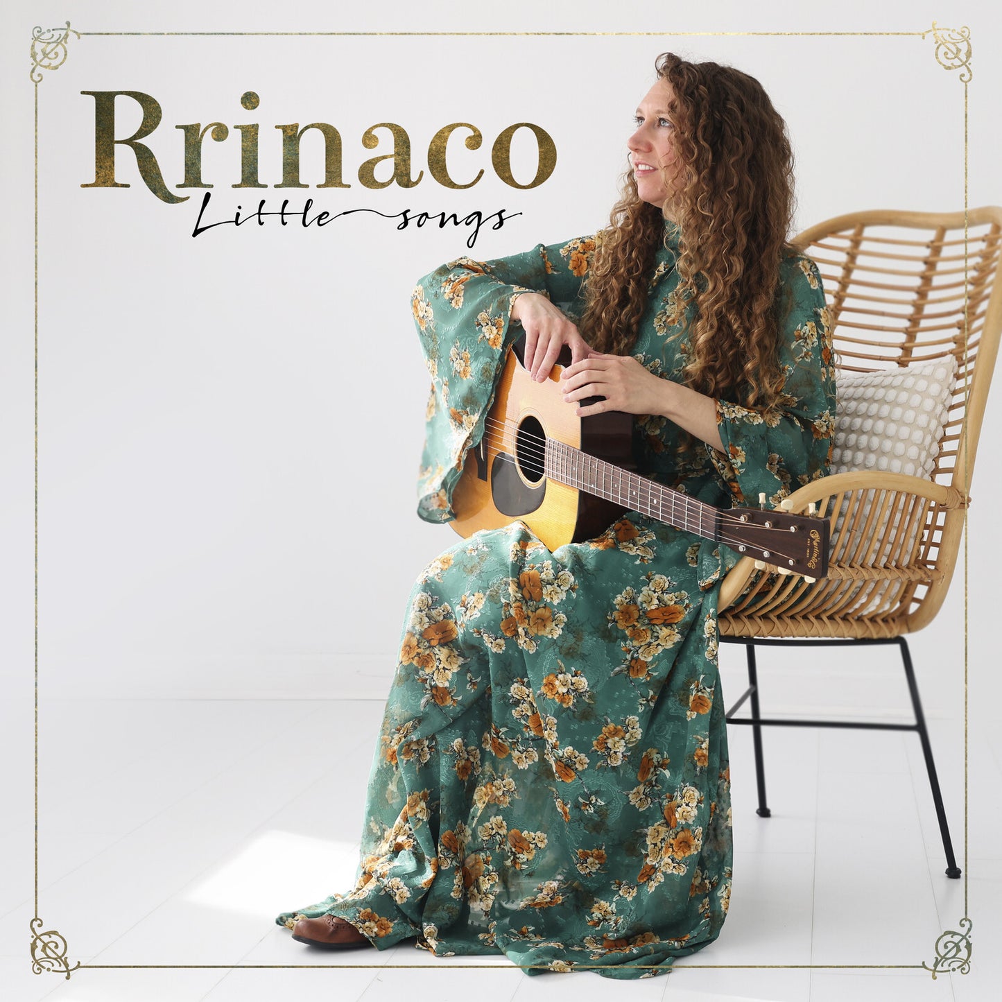 Woman with guitar on album cover for “Rrinaco - Little Songs.”