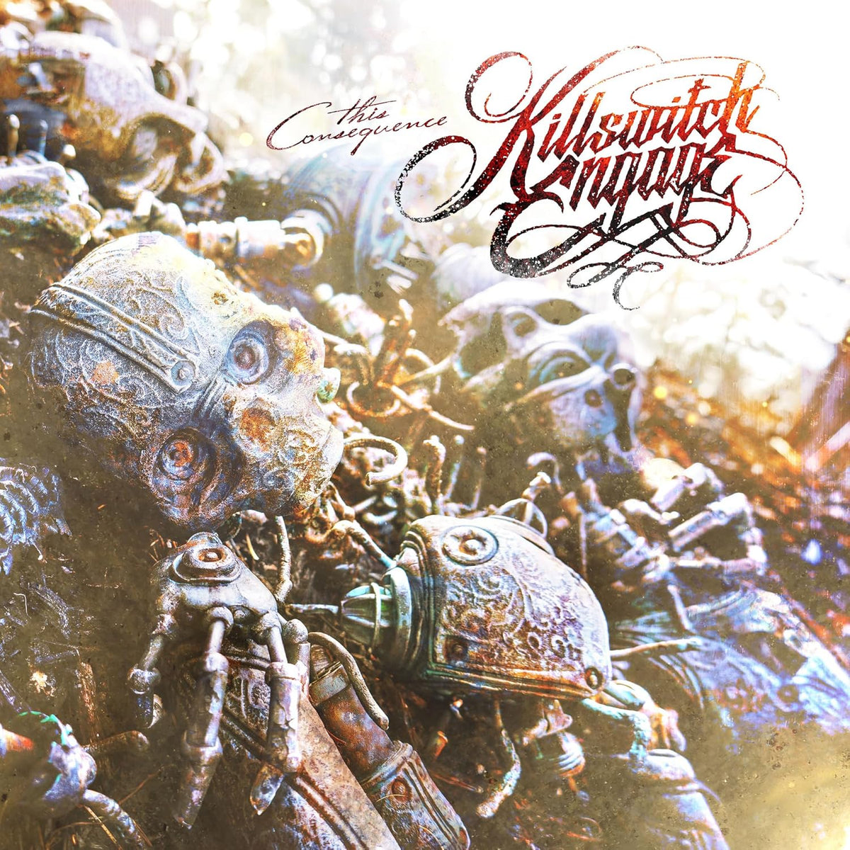 CD cover art featuring robotic heads and ornate script lettering.