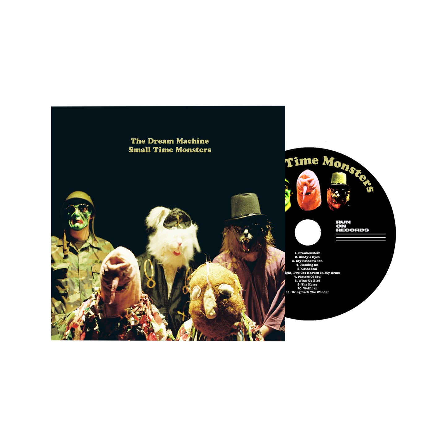 CD cover for "The Dream Machine" featuring three figures in hats.