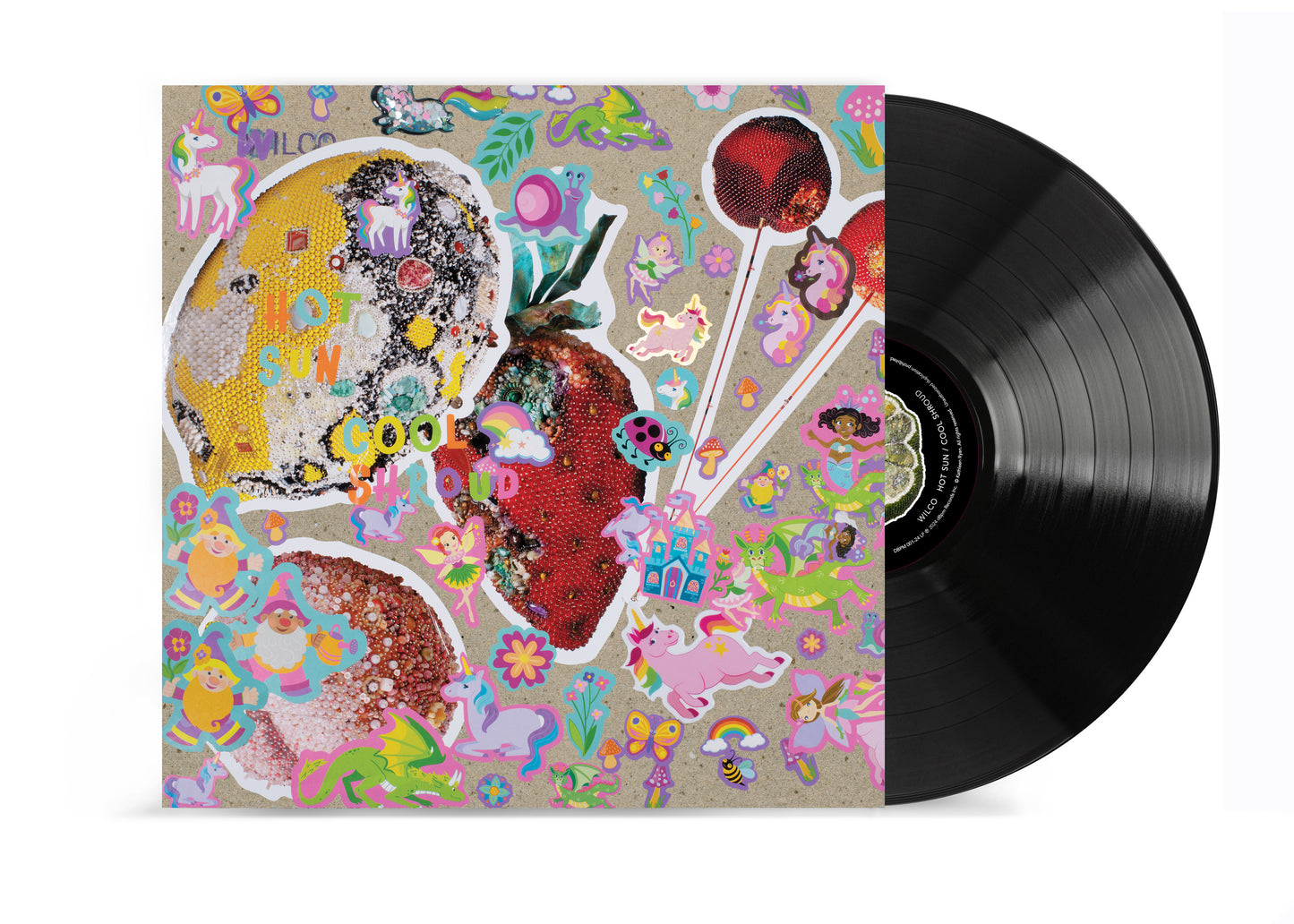 Wilco vinyl record featuring album cover art with strawberries, unicorns, and whimsical stickers.