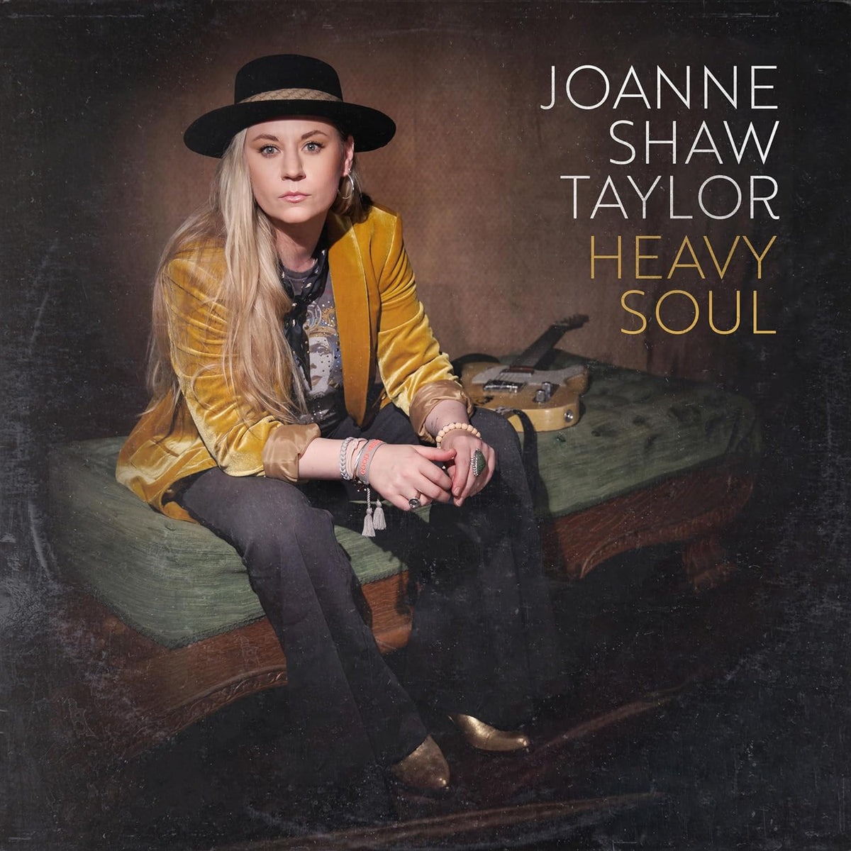Joanne Shaw Taylor album cover, portrait of a woman with a guitar.