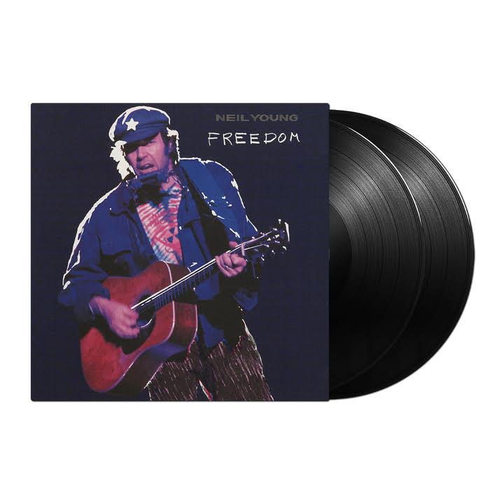 Neil Young “Freedom” vinyl record with cover art of Young playing guitar.