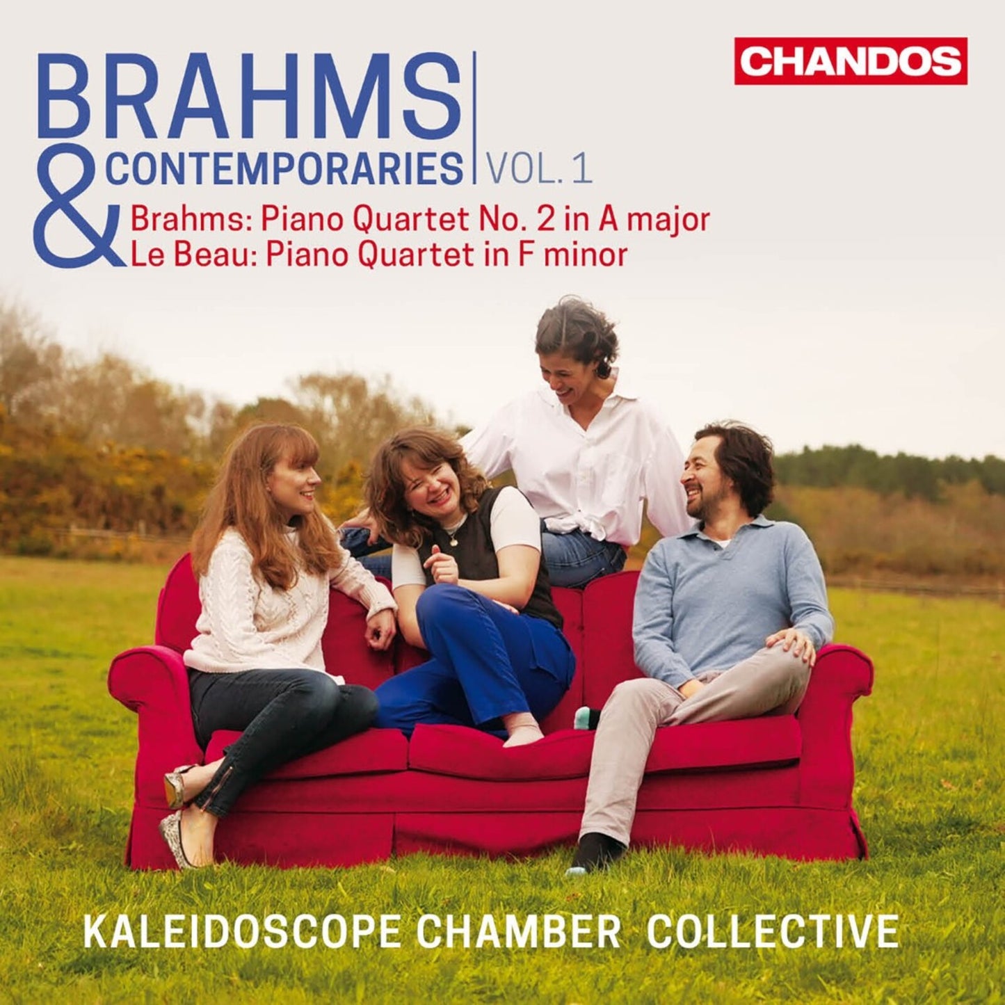 CD cover: four musicians smiling on a red couch in a field.