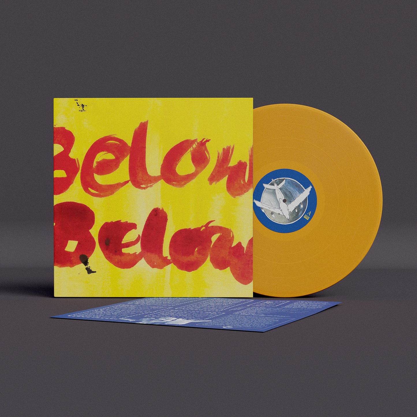 Yellow vinyl record with red text and airplane imagery, with insert.