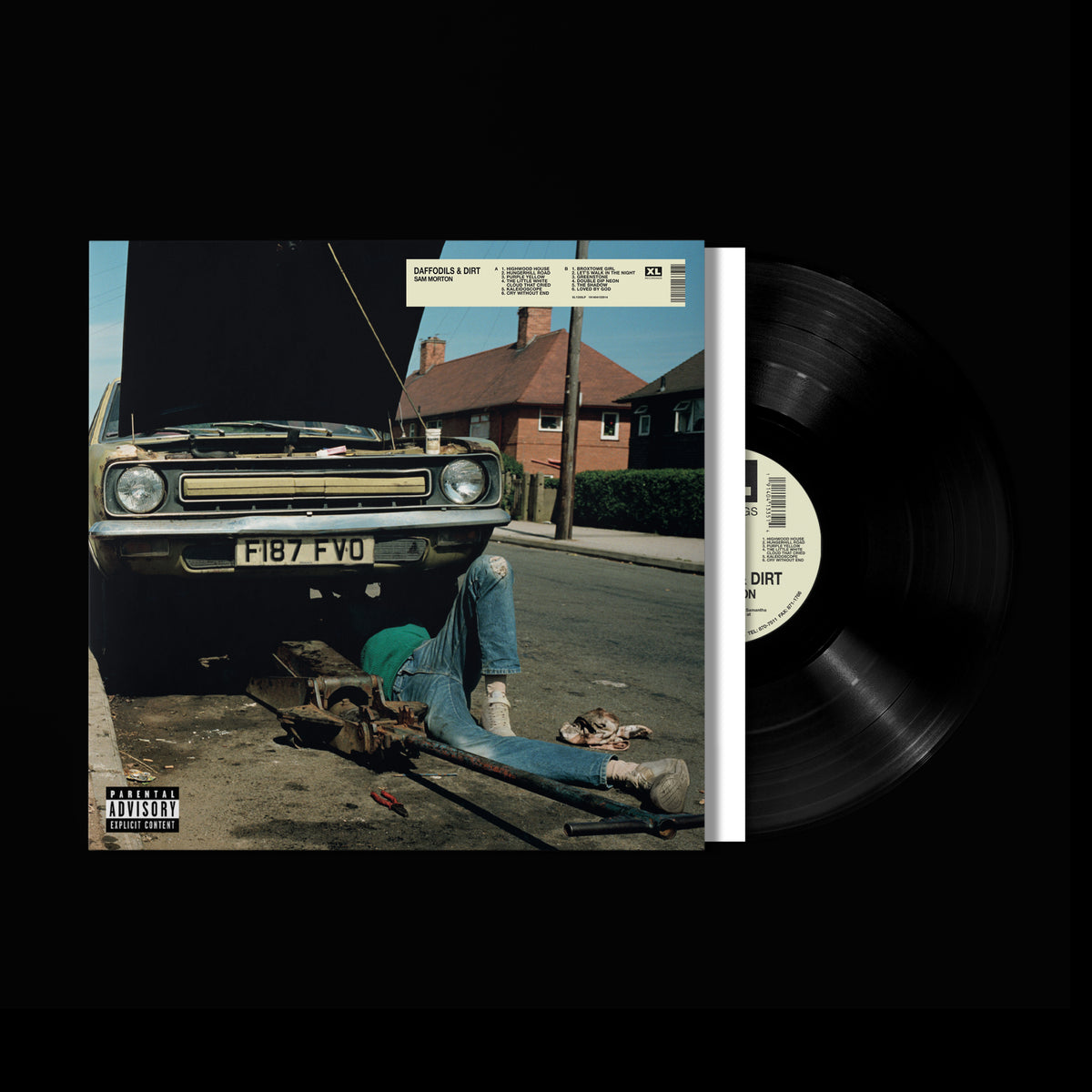 Vinyl record and album cover depicting a person working on a car.
