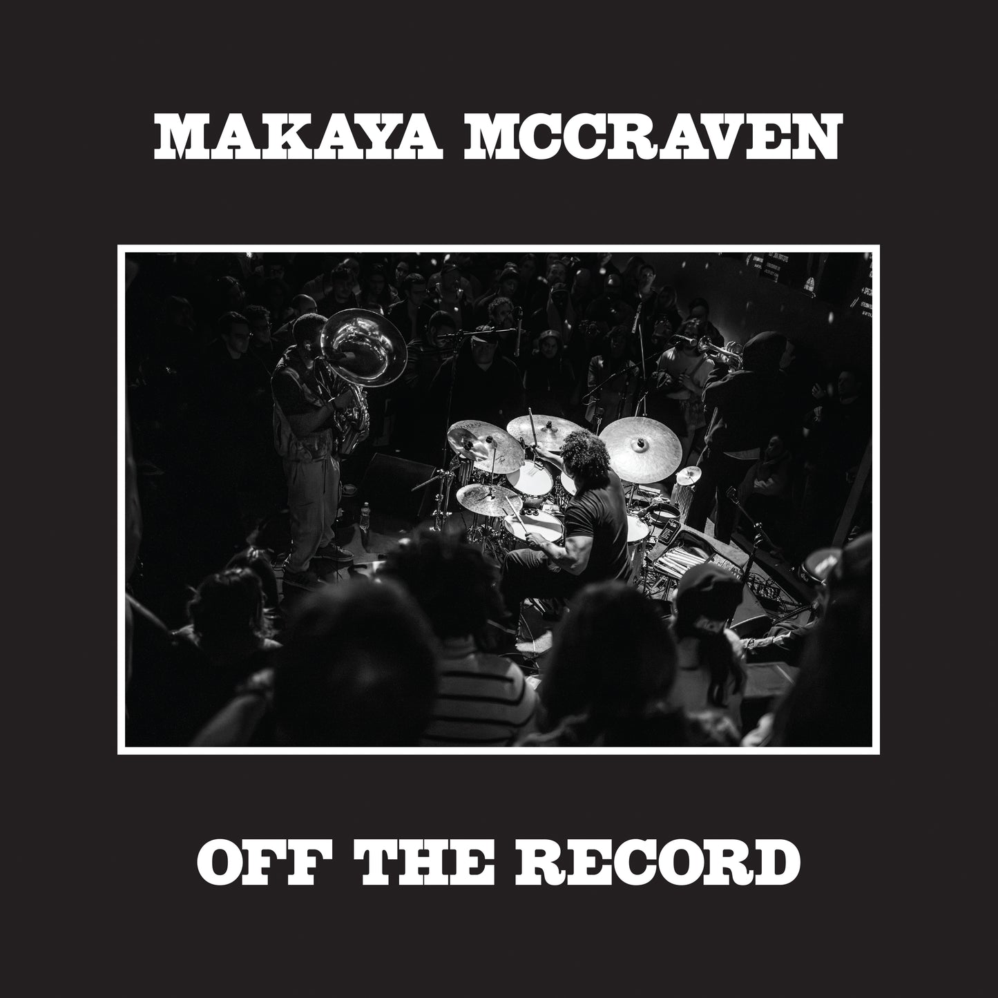 Makaya McCraven album cover: black and white jazz band performance photo.