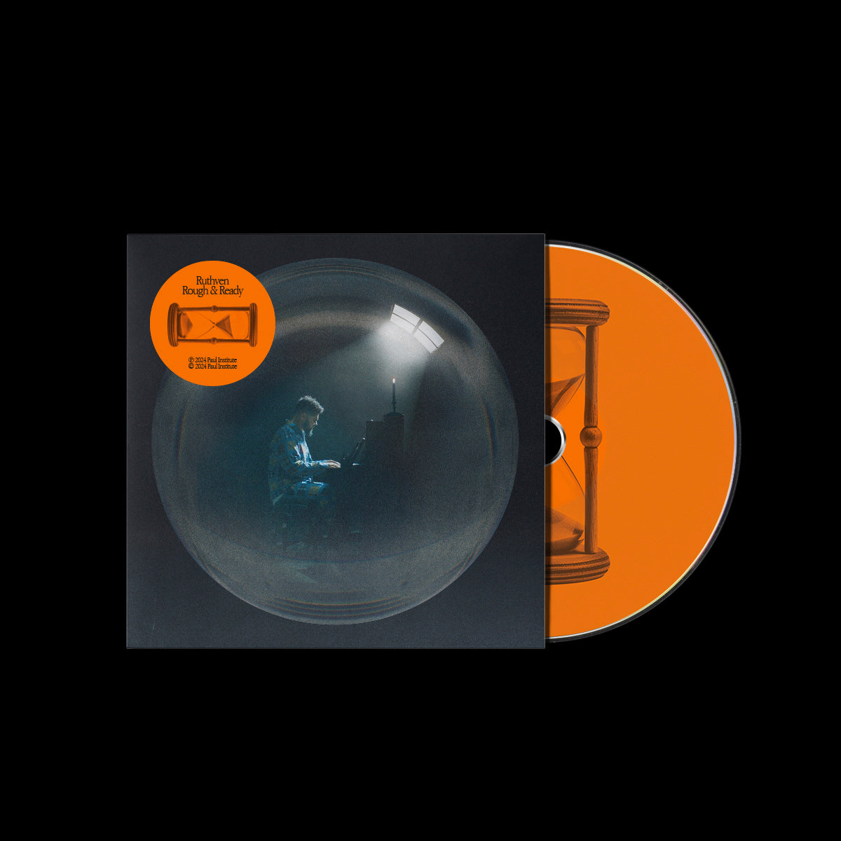 CD case with a man playing piano in a dimly lit room.