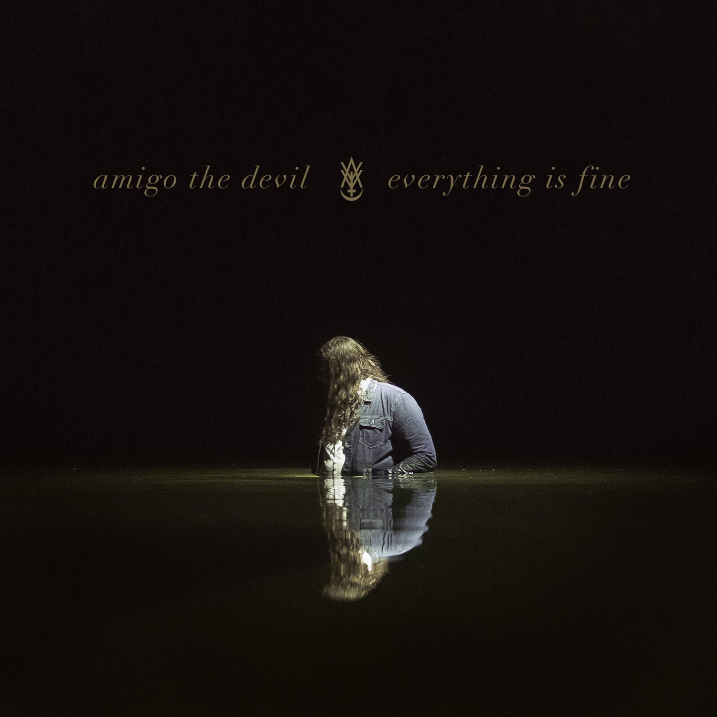 Dark album cover featuring a person sitting in water, reflected below.