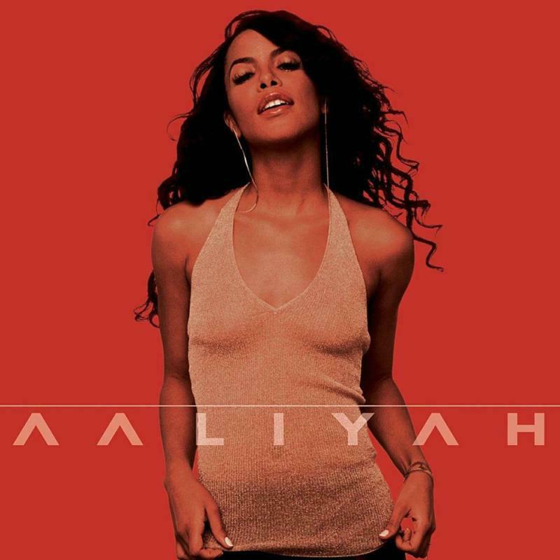 Aaliyah album cover with a portrait of the singer on a red background.