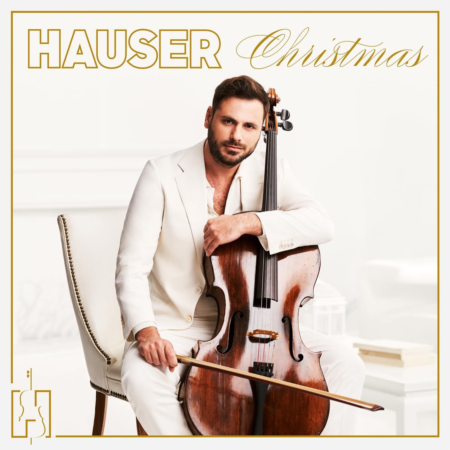 HAUSER in a white suit playing the cello, album cover art.