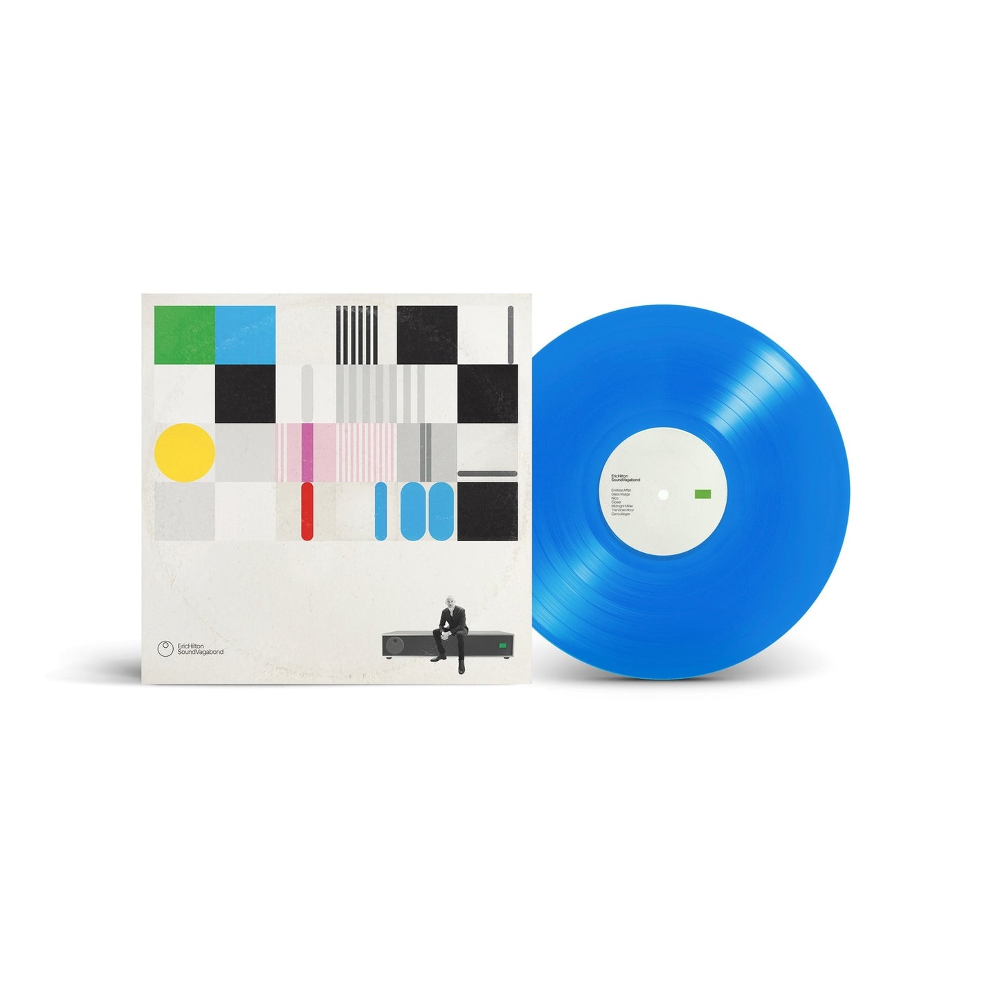 Eric Hilton album cover and blue vinyl record with abstract art.
