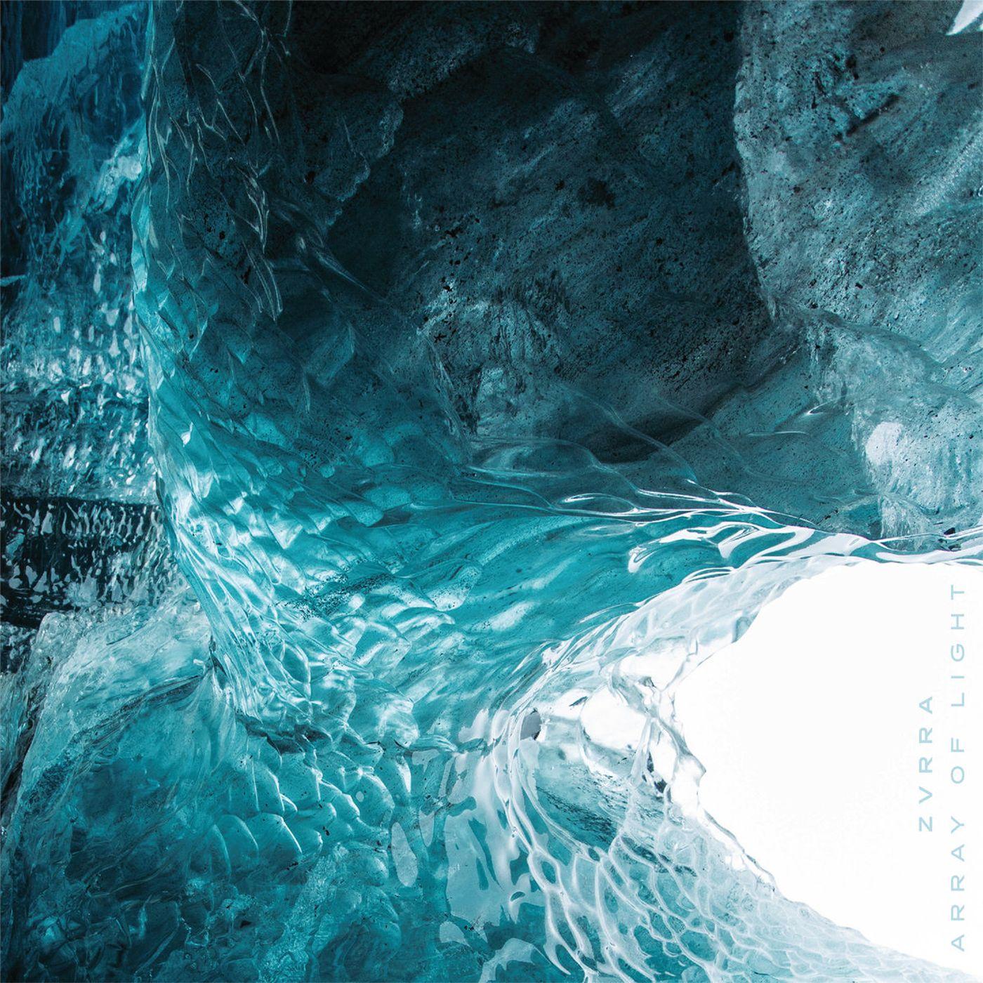 Blue and teal abstract ice cave image with album title text.