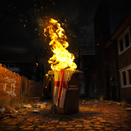 Burning trash bin with a flag, set in a dark urban street.