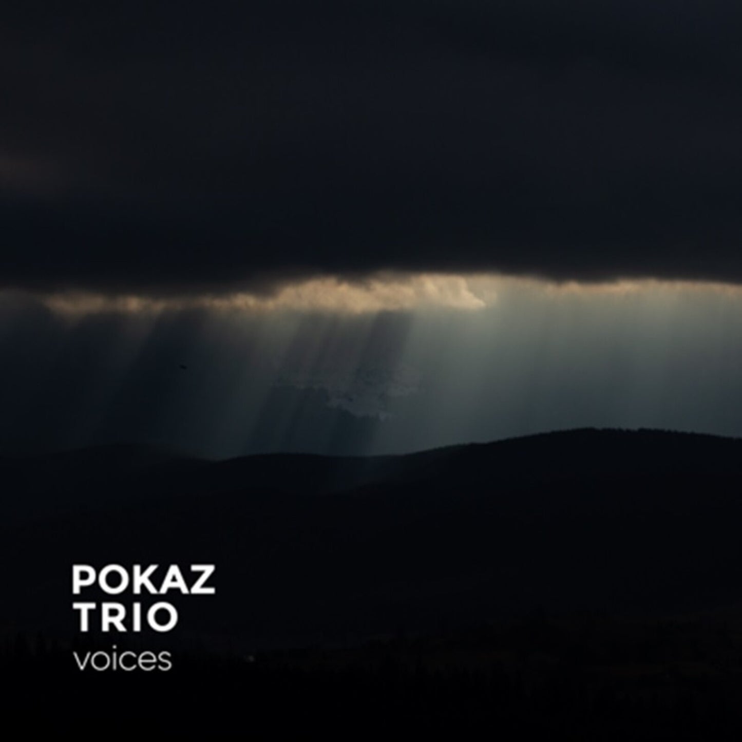 Dark album cover for Pokaz Trio’s “Voices” with light rays.