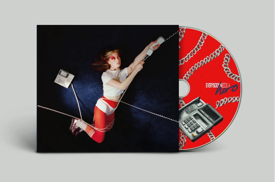 CD case with woman holding a telephone cord against a blue background.