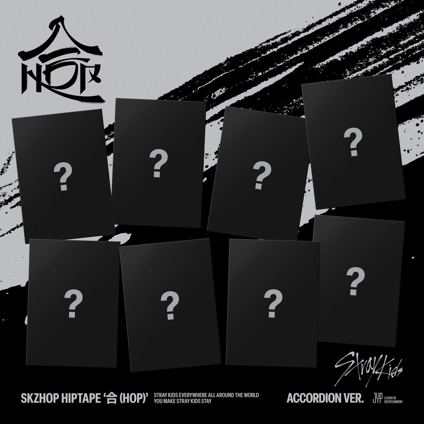 Stray Kids “HOP” accordion CD packaging with question marks on black covers.