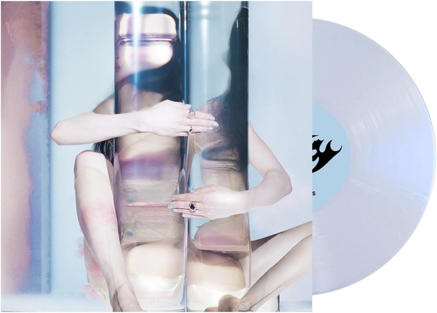 Vinyl record of Poppyâs âEmpty Handsâ with cover art of a person and logo.