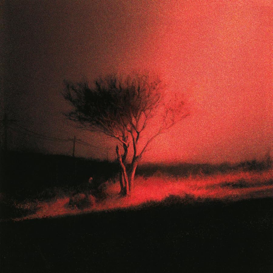 Red-toned landscape with a silhouetted tree and grainy texture.
