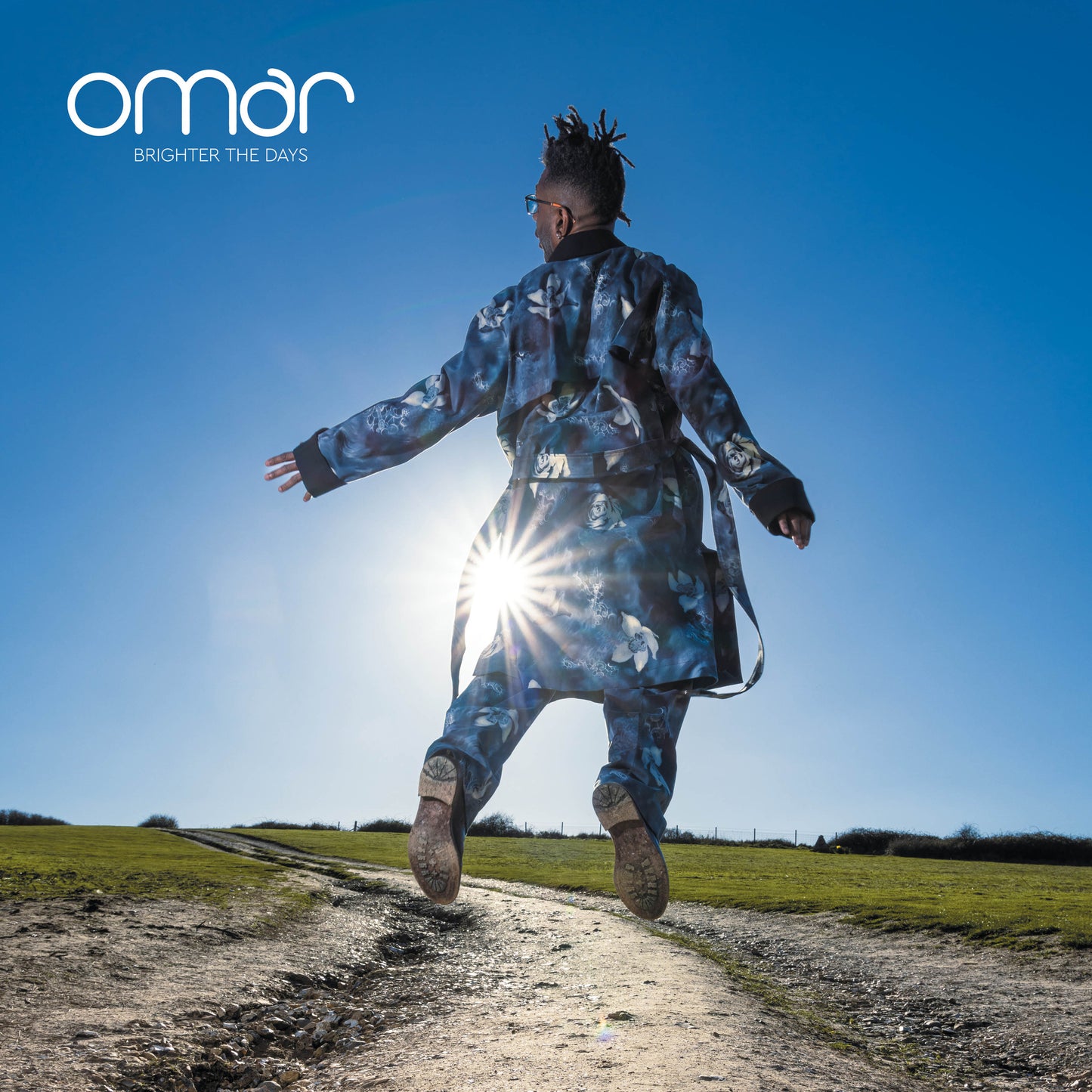 Album cover for Omar’s “Brighter The Days” featuring a leaping figure.