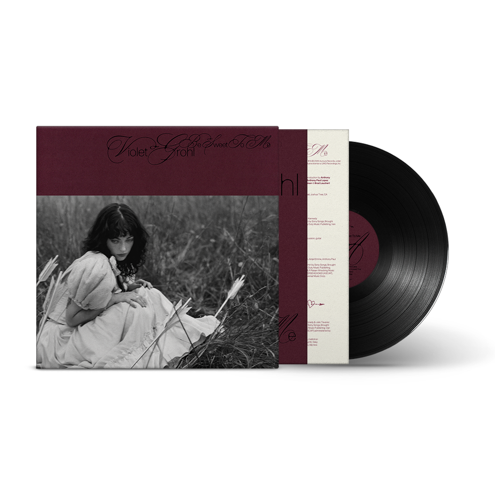Black and white album cover featuring a young woman in a field.