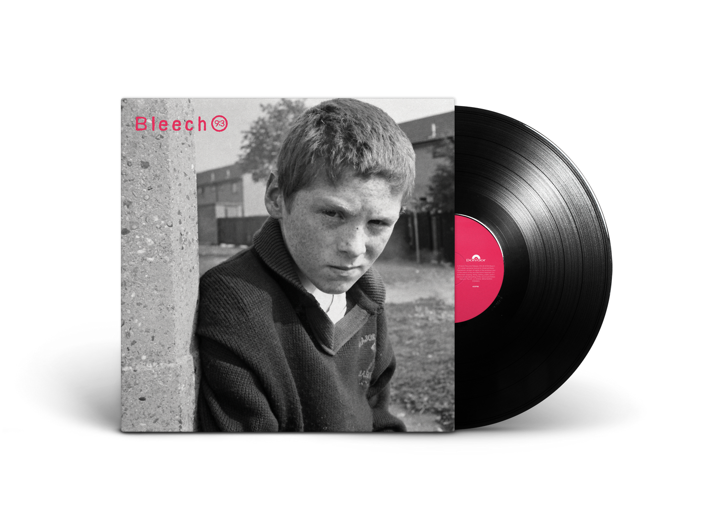 Black and white portrait of a young boy with a vinyl record.