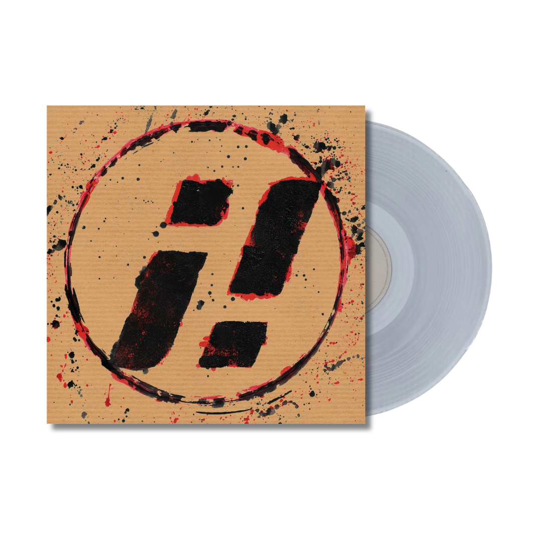 Clear vinyl record with cover featuring a red, splattered exclamation point.