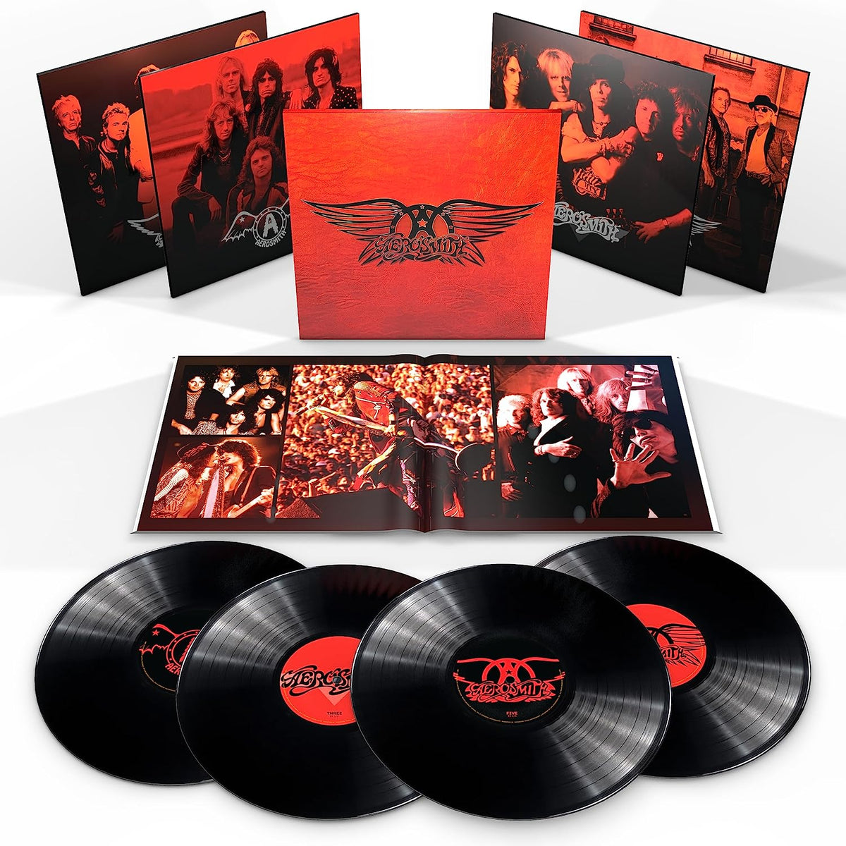 Aerosmith’s four vinyl records and box set, featuring band photos and logos.