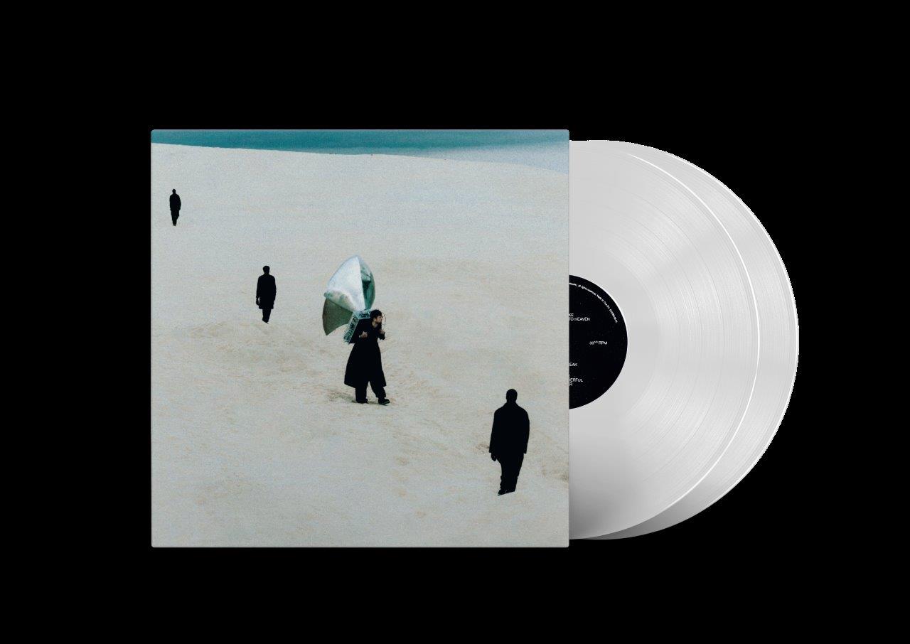 James Blake album cover with figures on a snowy beach and vinyl record.