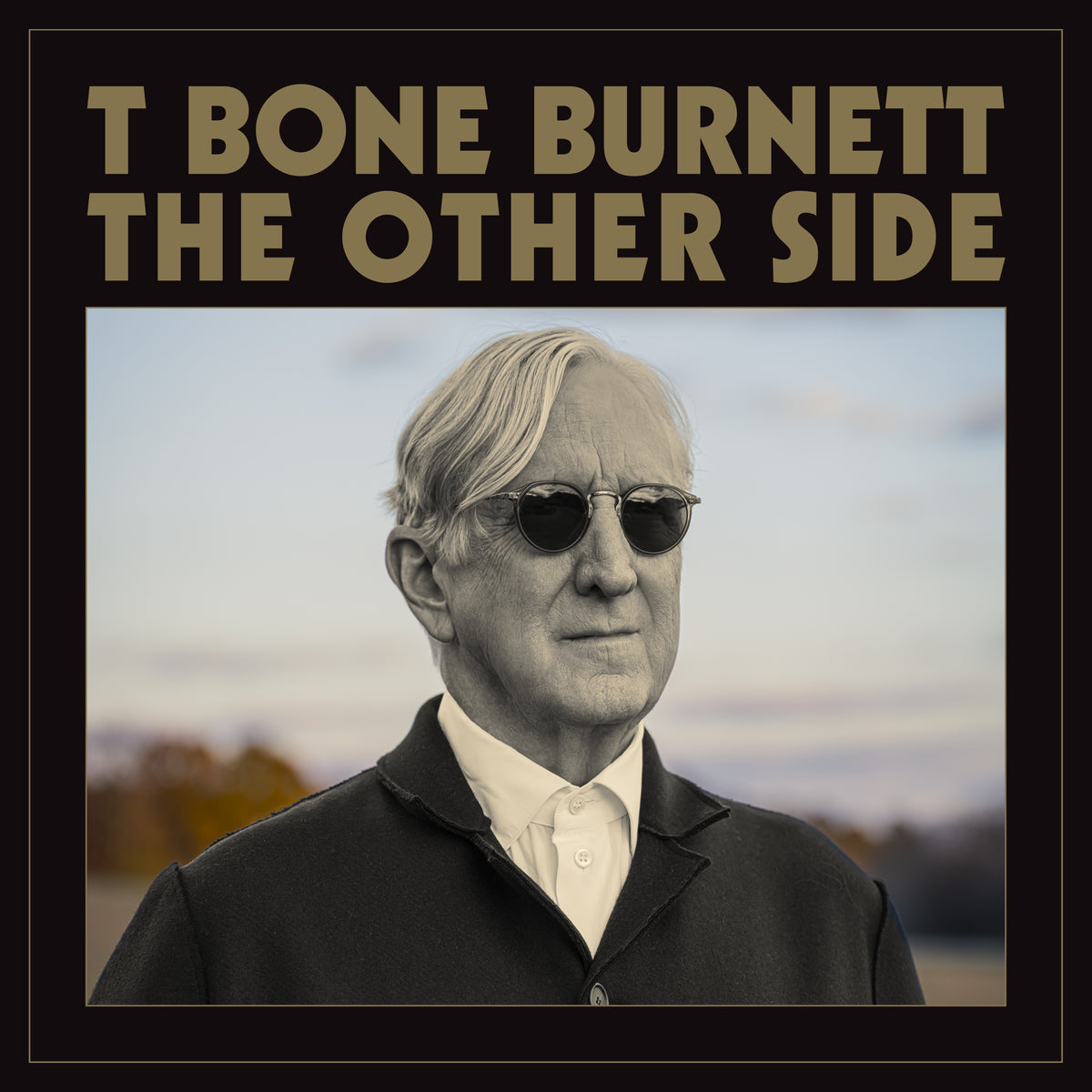T Bone Burnett album cover featuring a portrait of the artist in sunglasses.