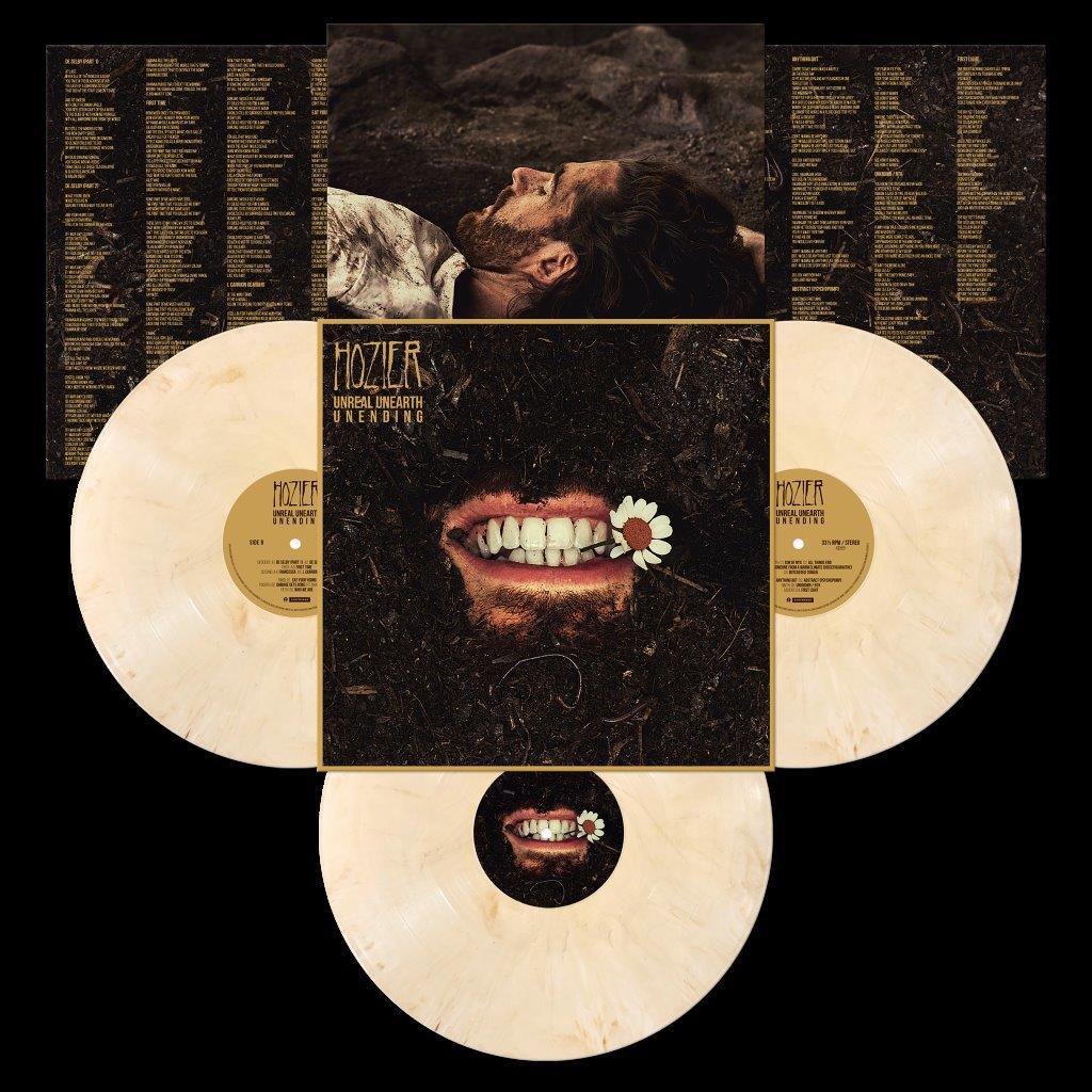 Hozier's "Unreal Unearth Unending" white vinyl LP packaging and records laid flat.