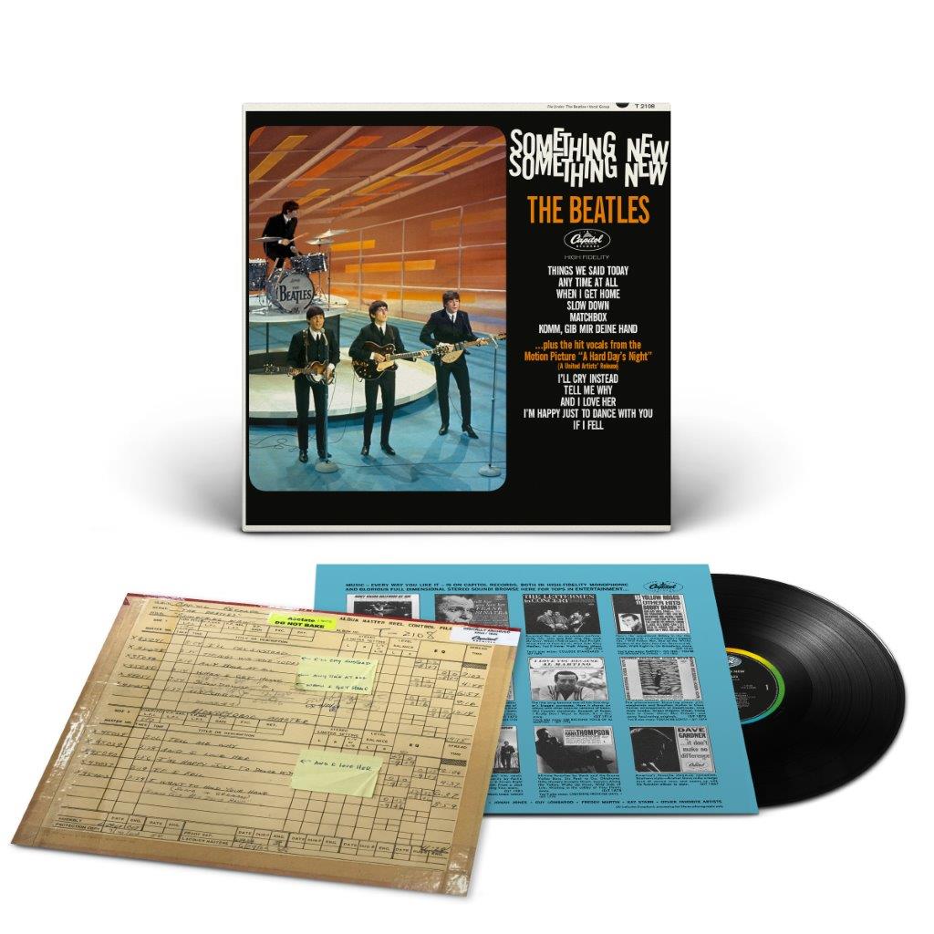 The Beatles’ “Something New” vinyl record with album cover and inserts.