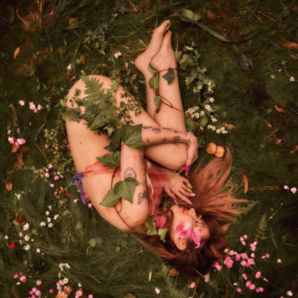 Person lying in foliage, album cover for Peach PRC’s “Porcelain” CD.