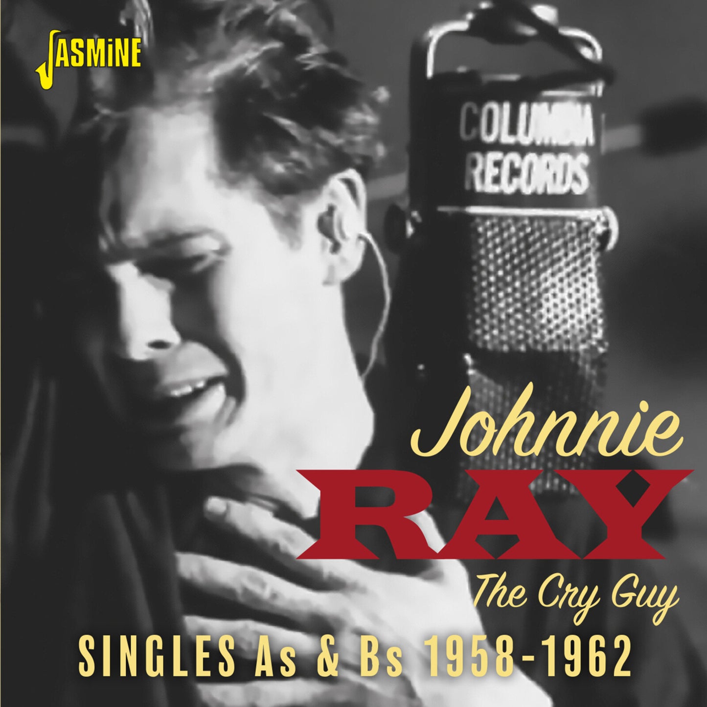 Black and white CD cover featuring singer Johnnie Ray with a microphone.