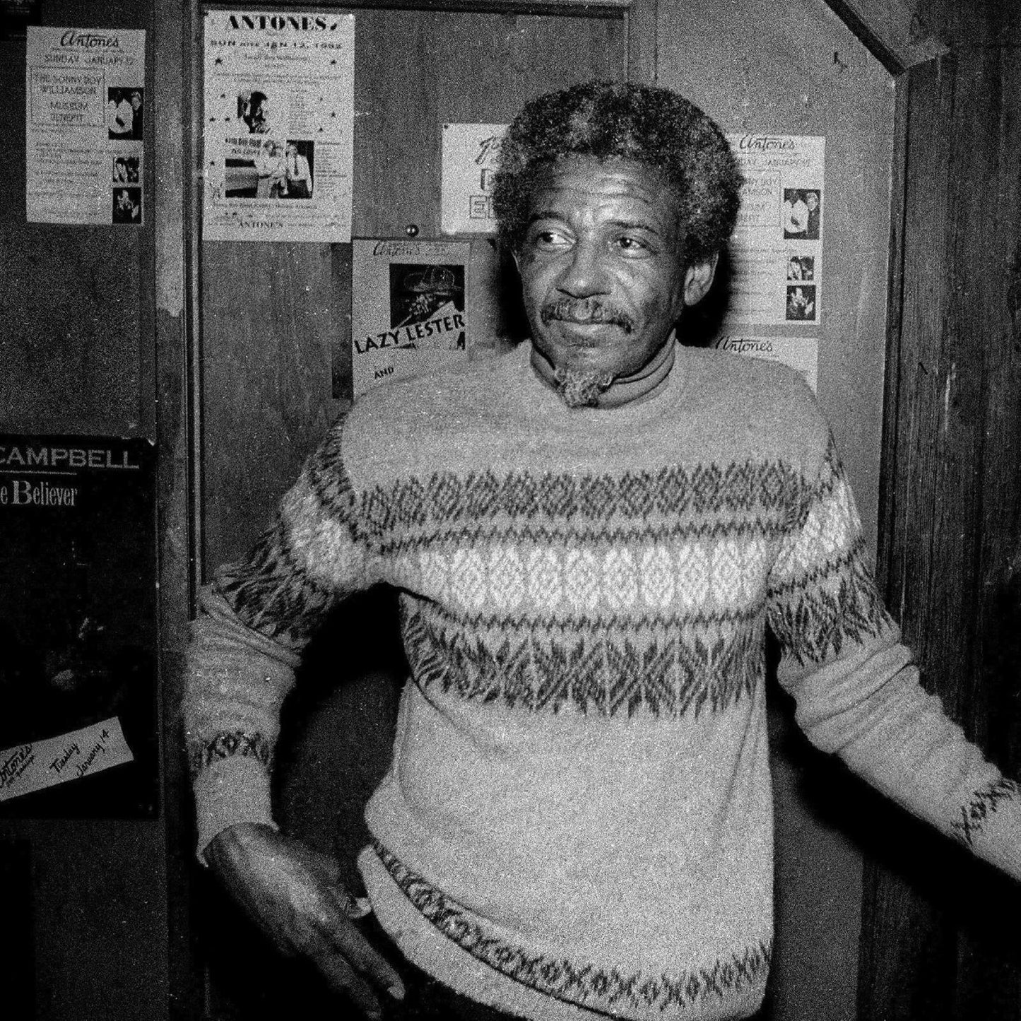 Black and white portrait of musician Lazy Lester wearing a patterned sweater.