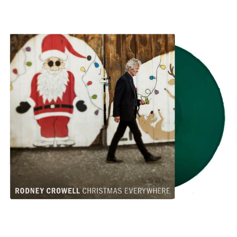 Vinyl record cover featuring a man walking past a Santa mural.