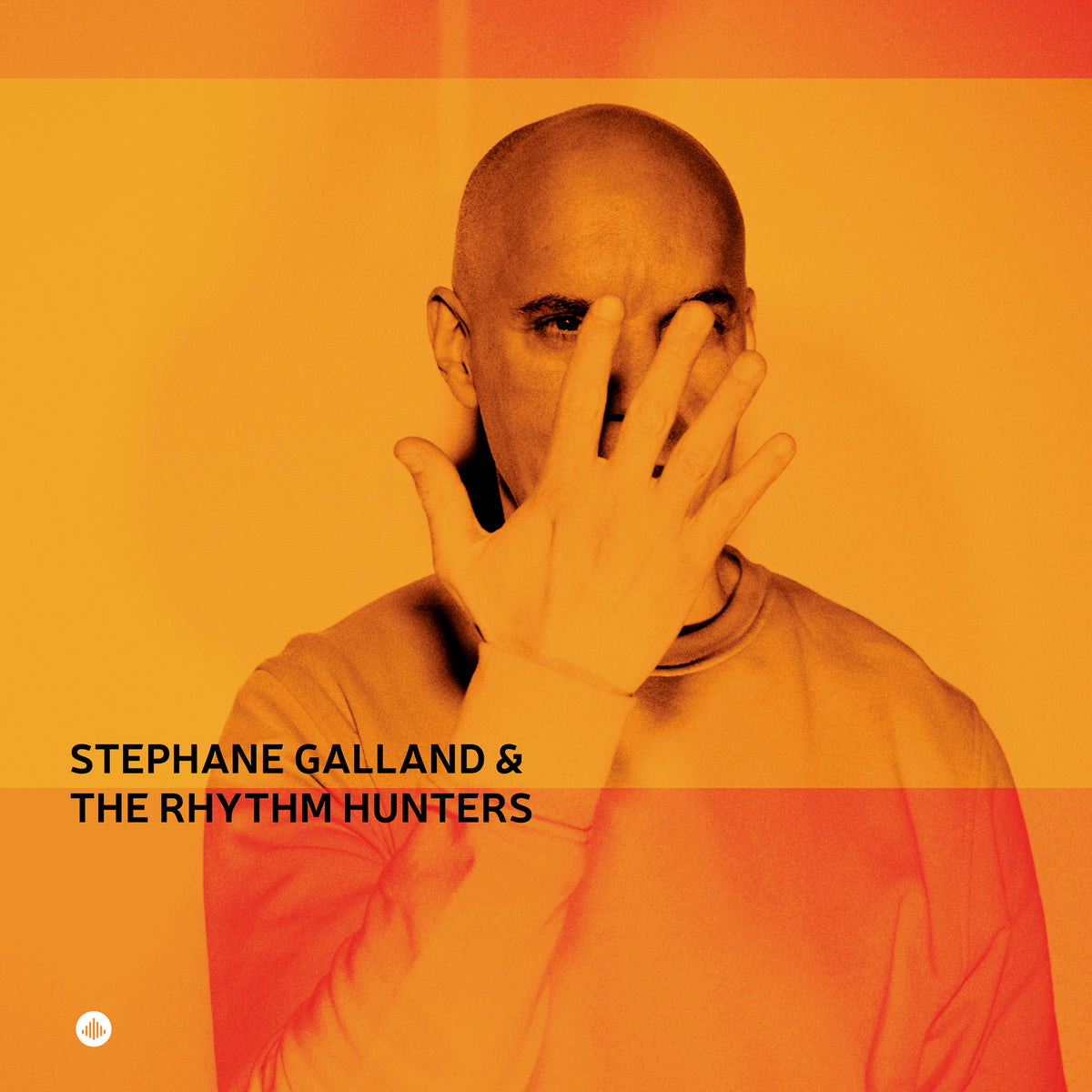 Album cover featuring a bald man partially obscuring his face with his hand.