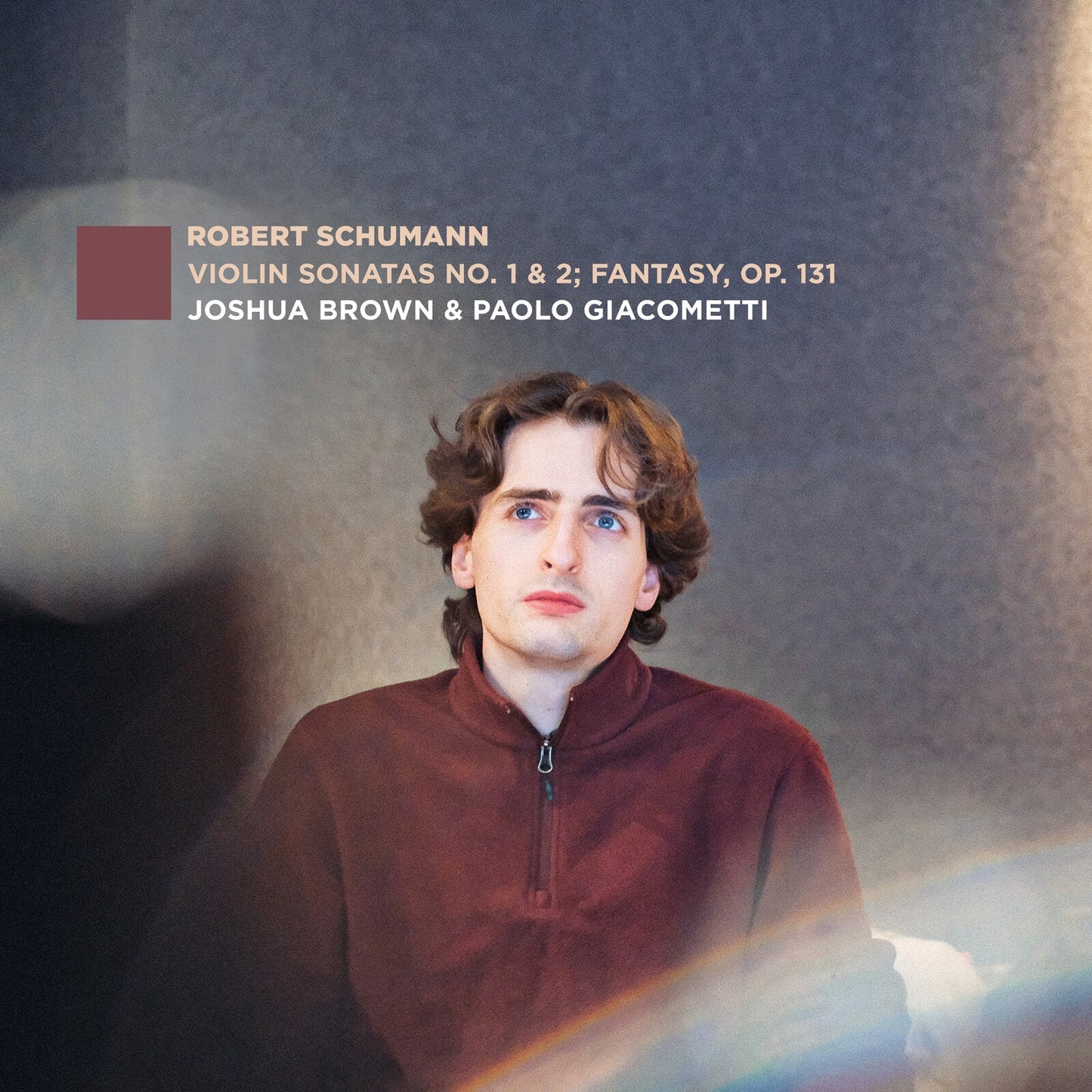 CD cover featuring a young man and text listing composers and artists.