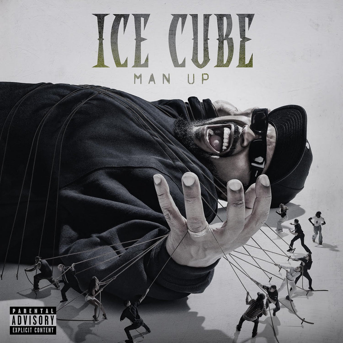 Ice Cube album cover, "Man Up," showing a giant hand controlling small figures.