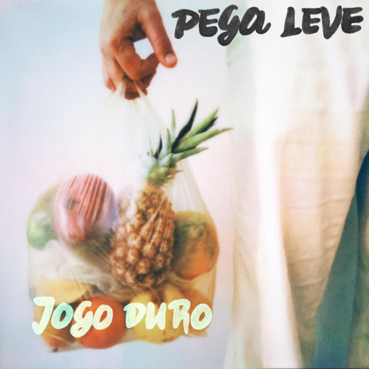 Vinyl record cover with hand holding plastic bag of fruit.
