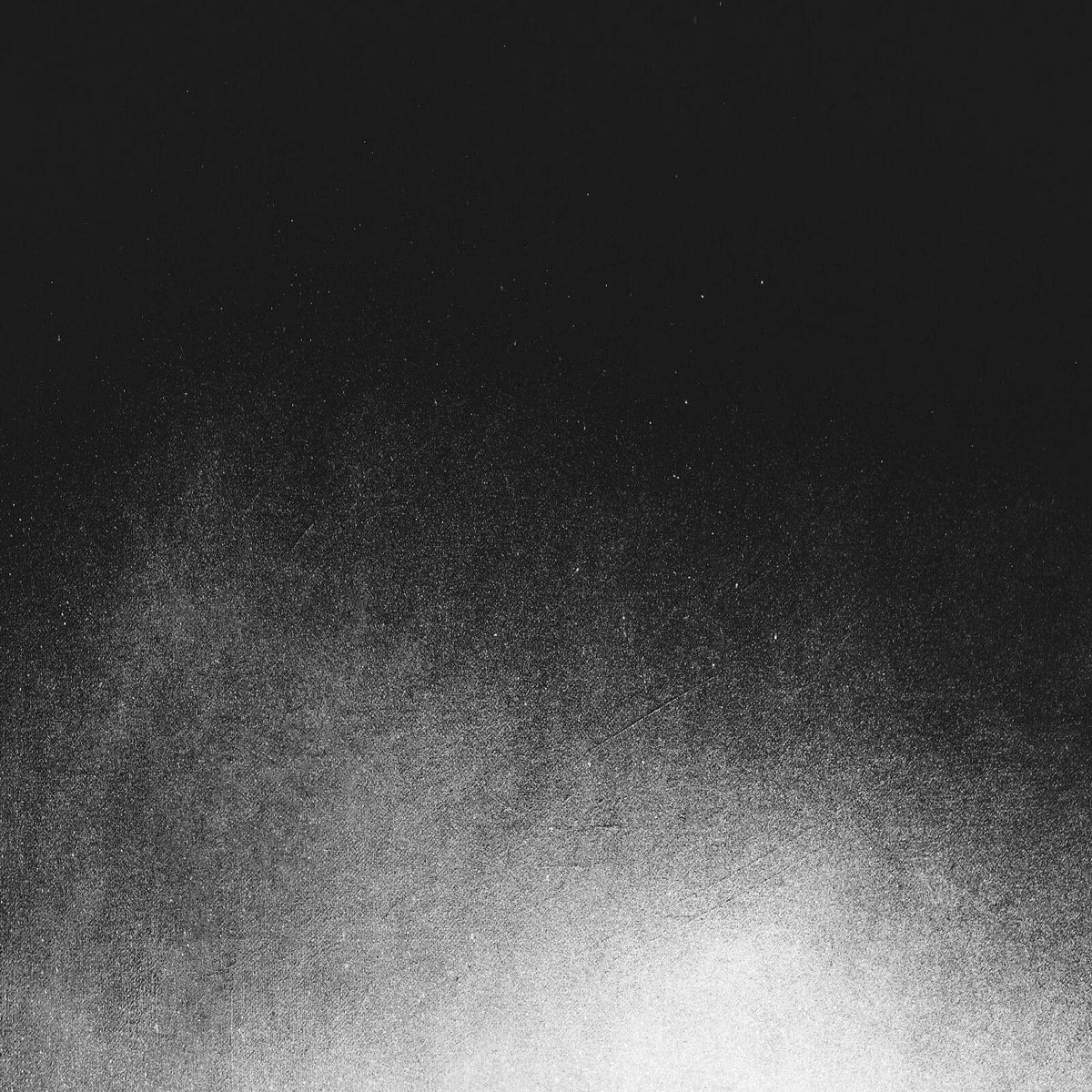 Black and white grainy texture, fading from light to dark.