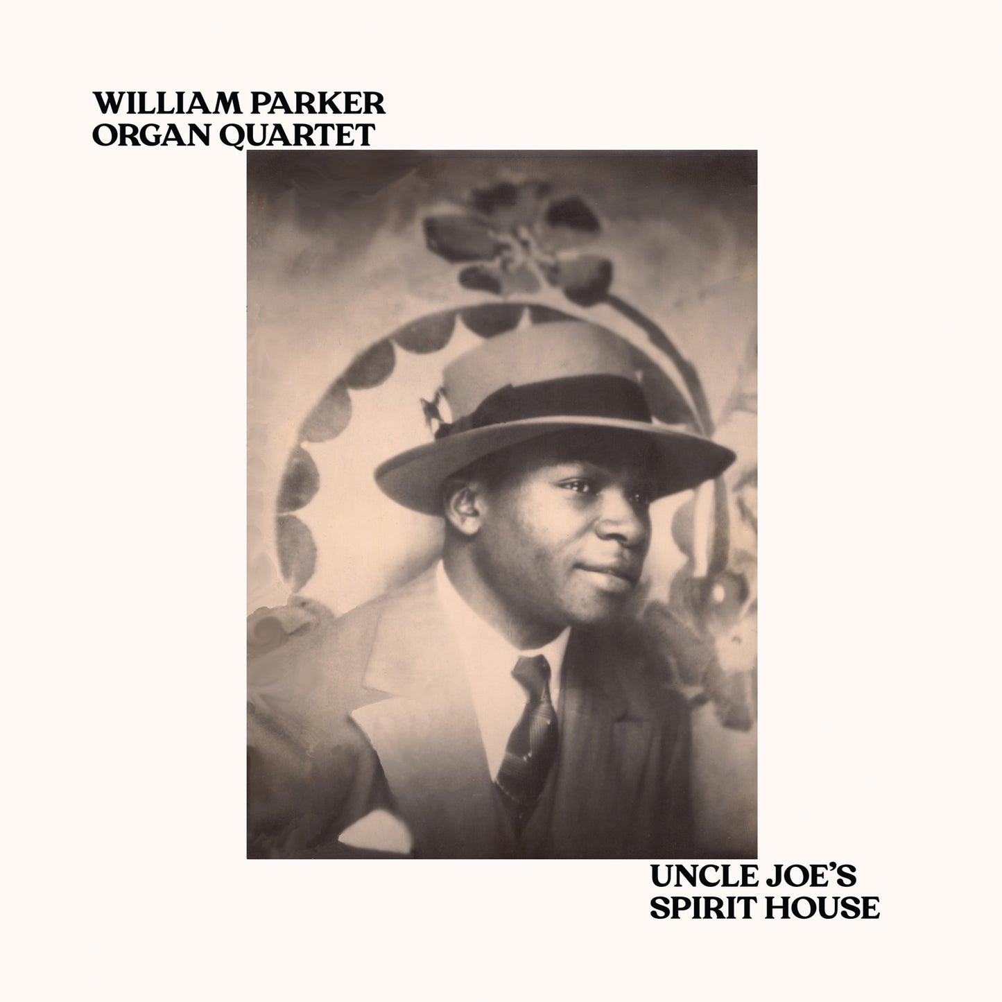 Sepia-toned album cover featuring a portrait of a man in a hat.
