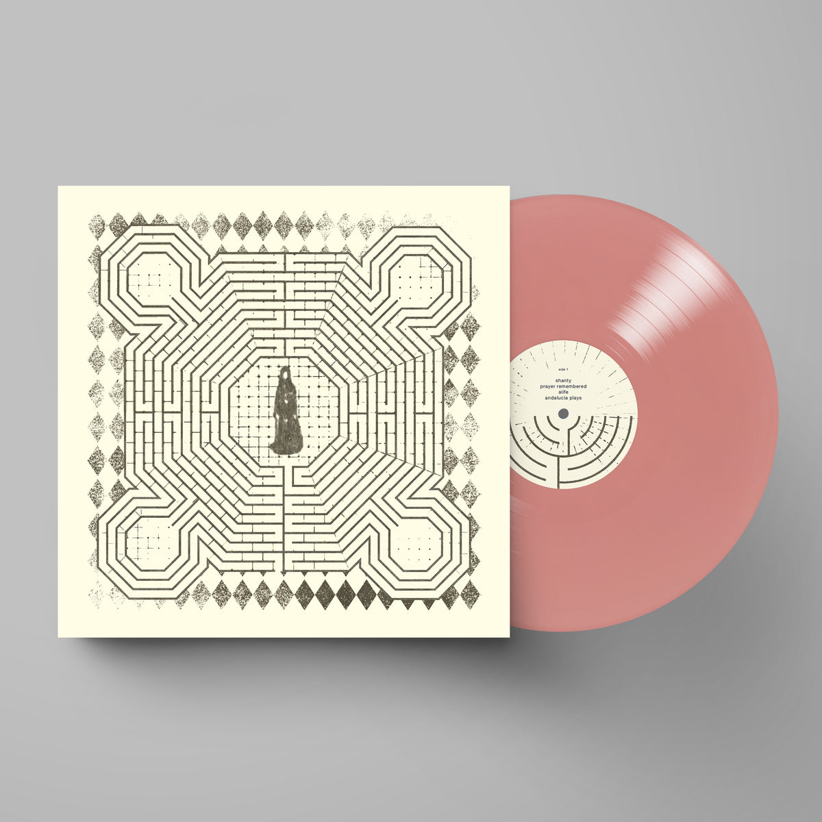 Slowdive album cover with a labyrinth design and a pink vinyl record.