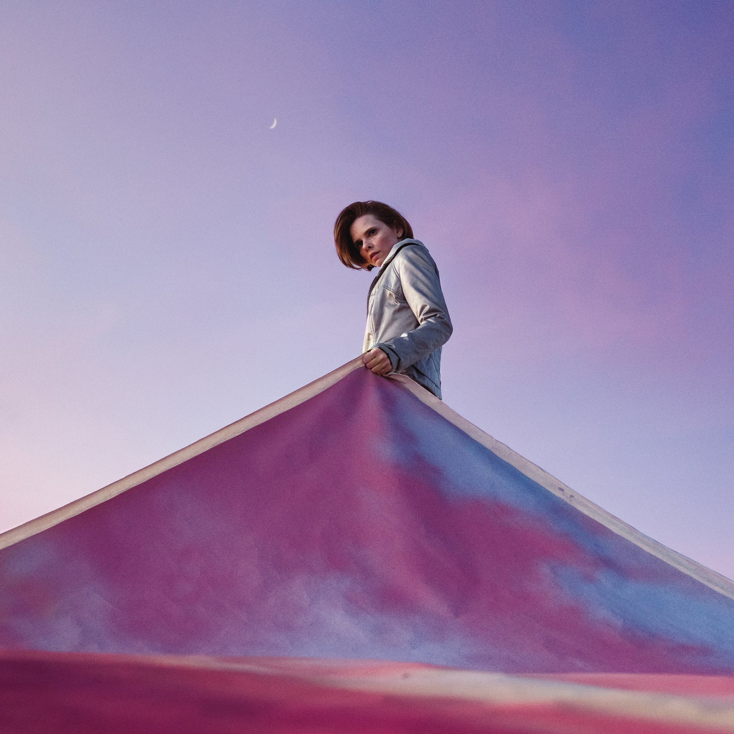 Cassandra Jenkins album cover featuring a woman holding colorful fabric.