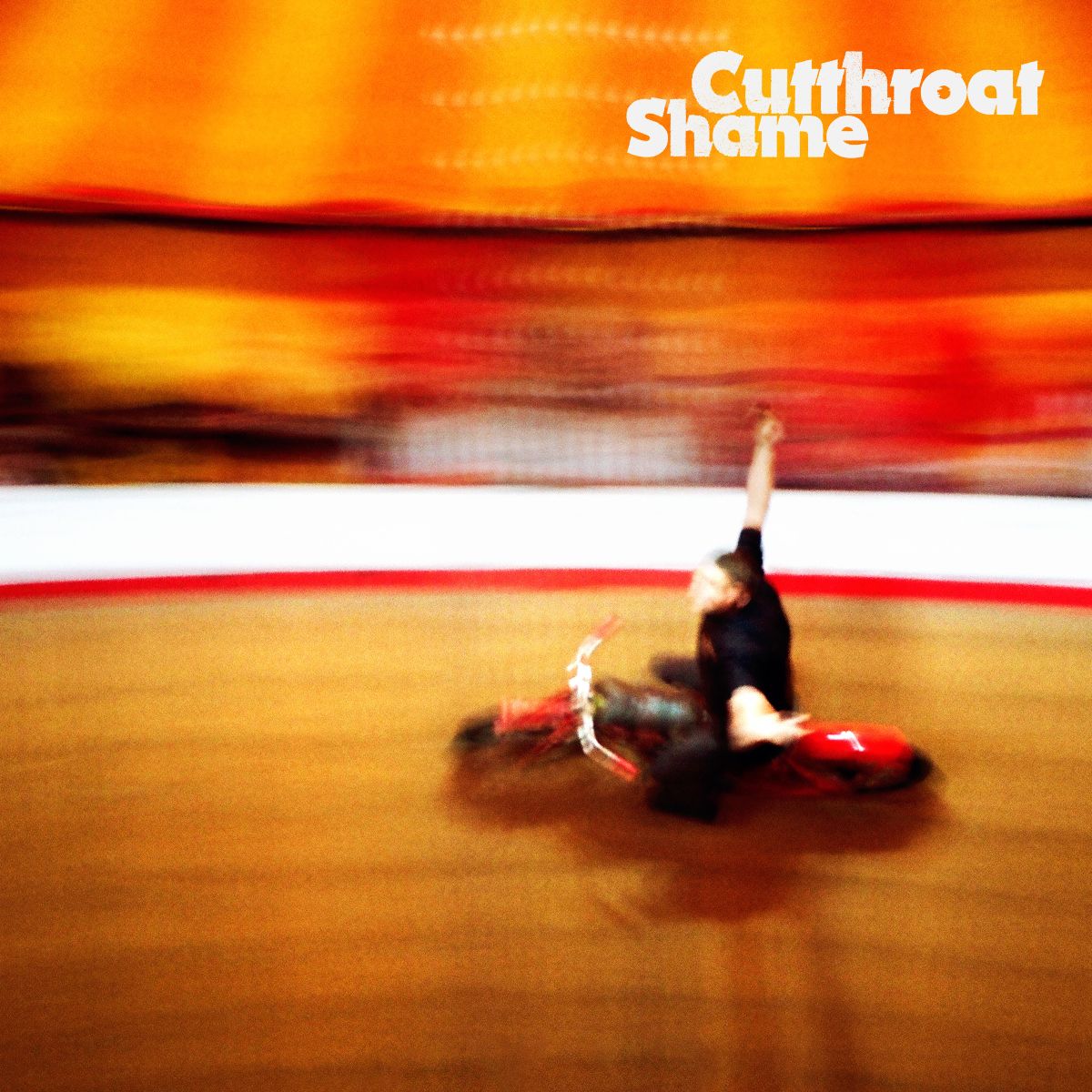 Album cover for Shame’s “Cutthroat” featuring a blurred figure on a motorcycle.