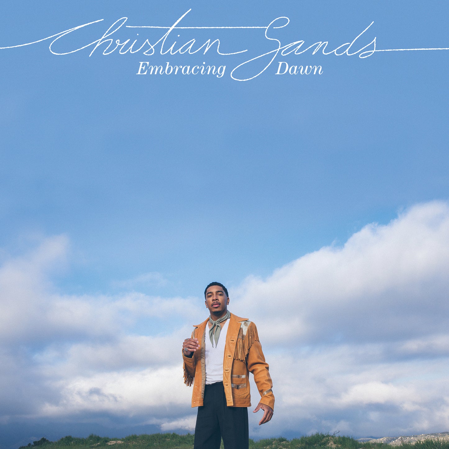 Christian Sands album cover featuring a man in a tan jacket, blue sky.