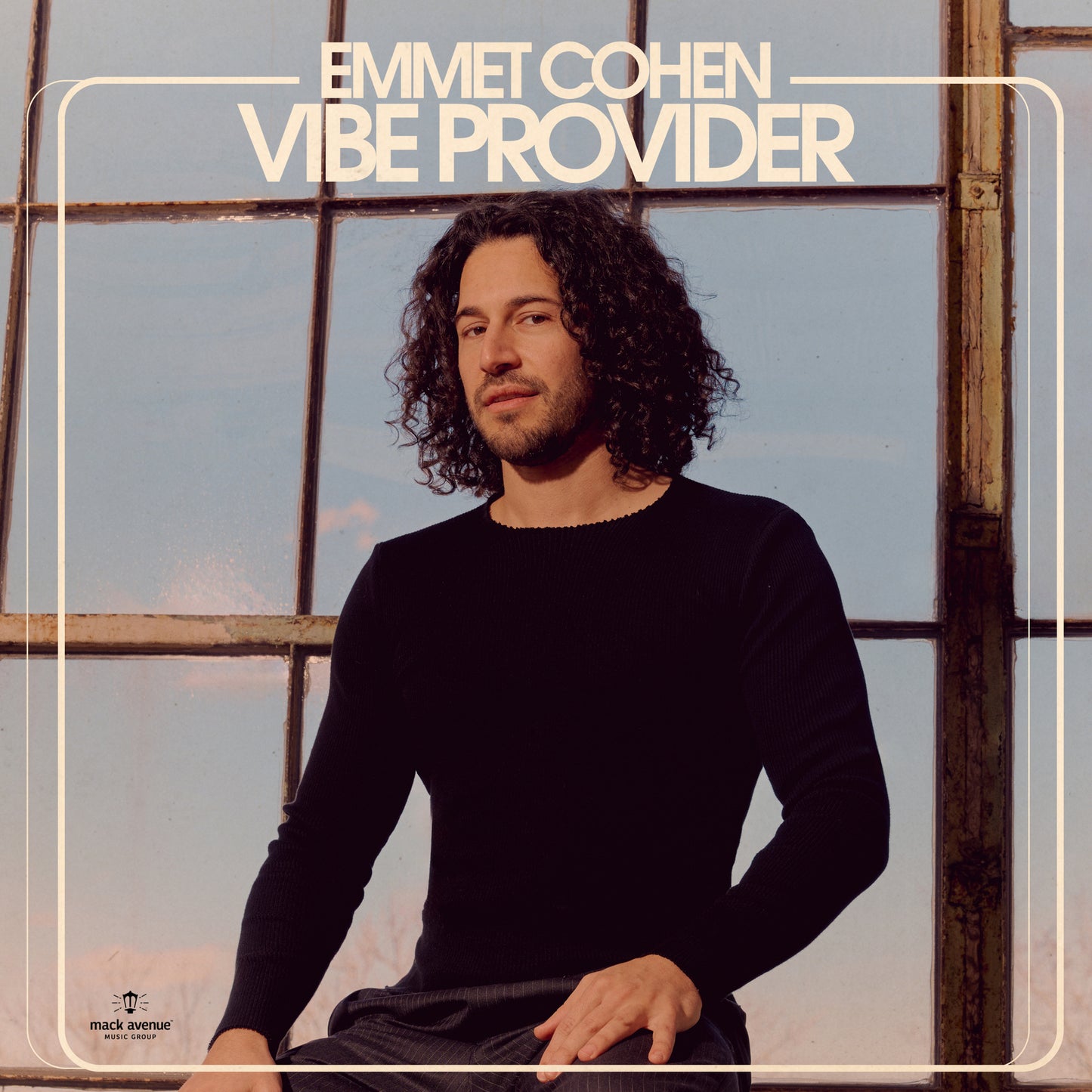 Album cover for Emmet Cohen's "Vibe Provider" featuring a portrait of the artist.