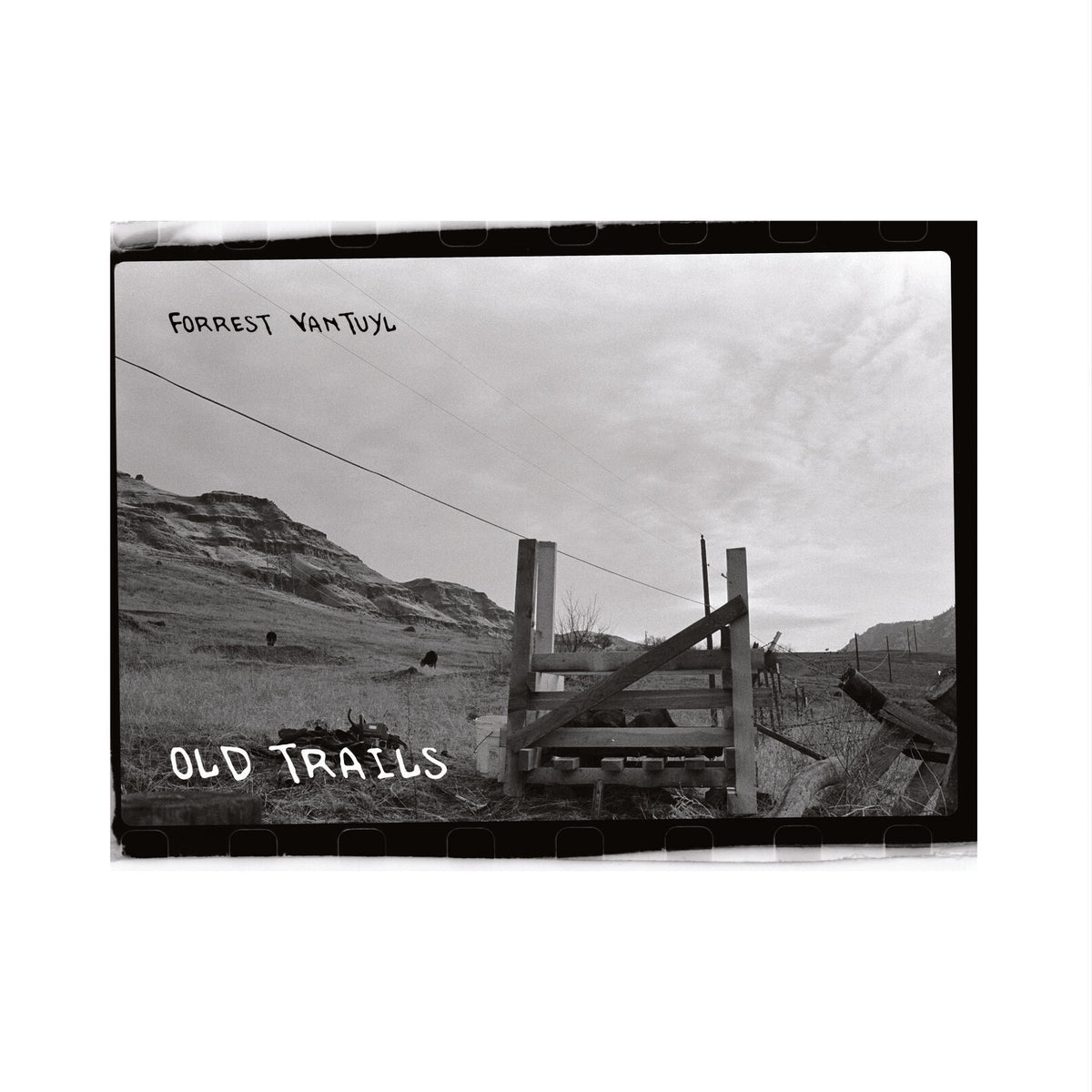 Black and white album cover featuring a rural landscape and wooden fence.