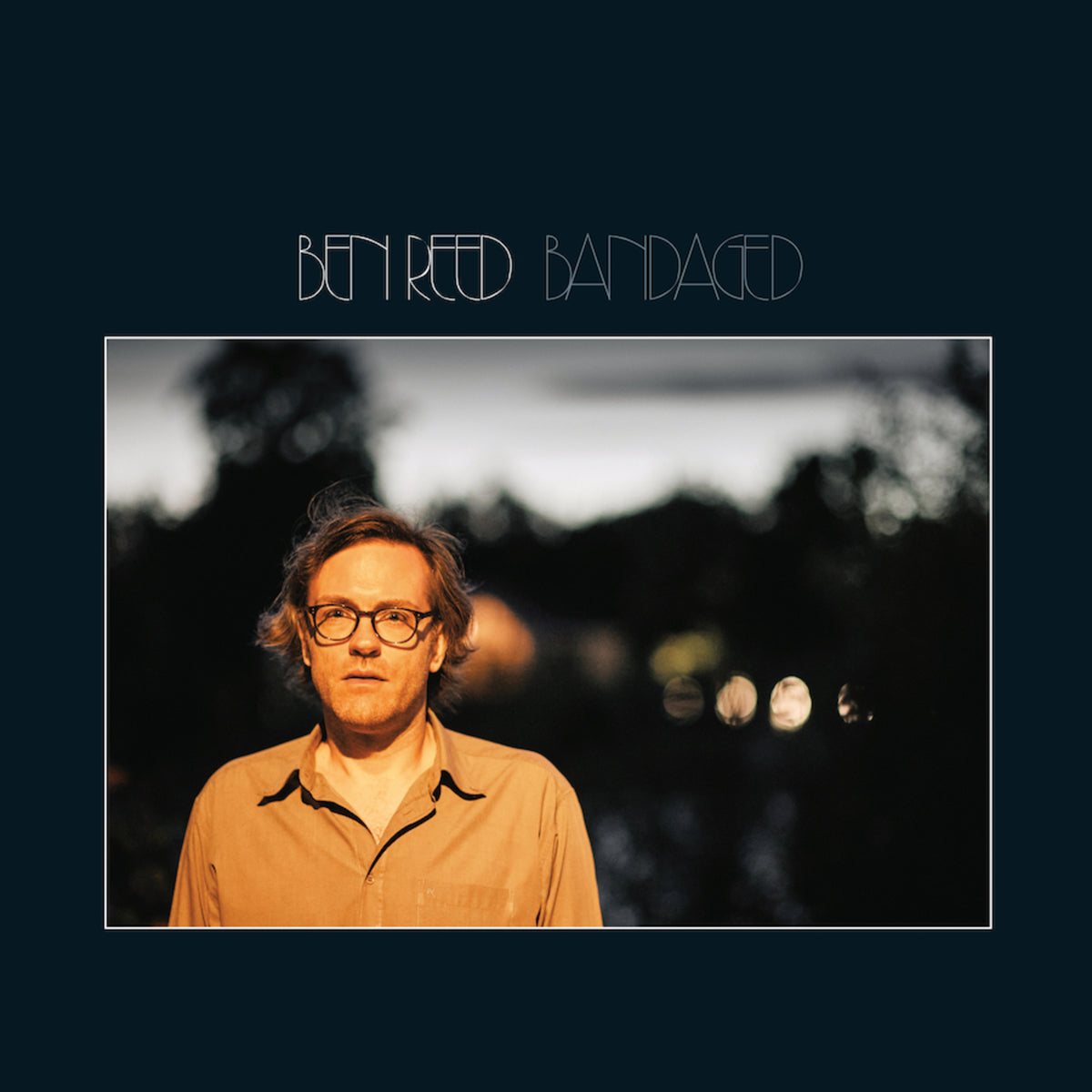 Album cover for Ben Reed’s “Bandaged” featuring a portrait of the artist.