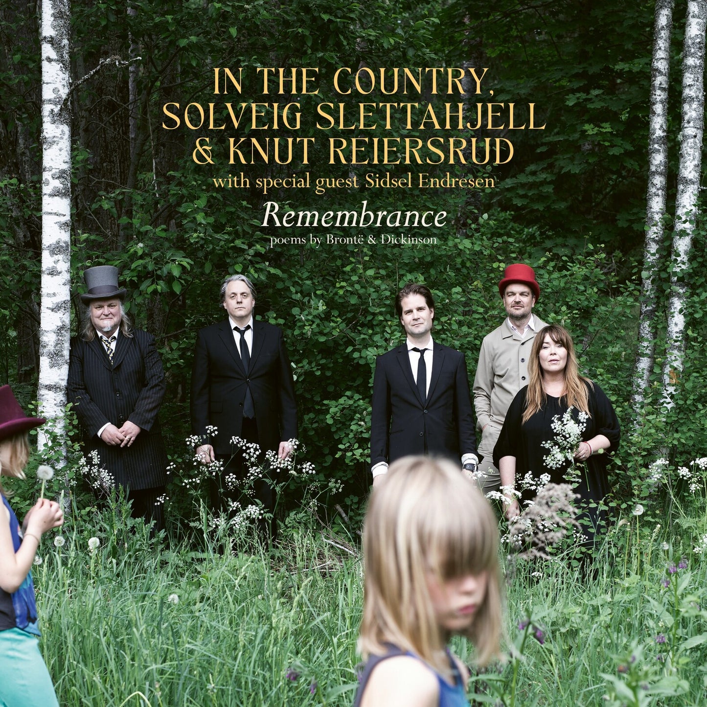 Album cover: group portrait in a forest, titled “Remembrance.”